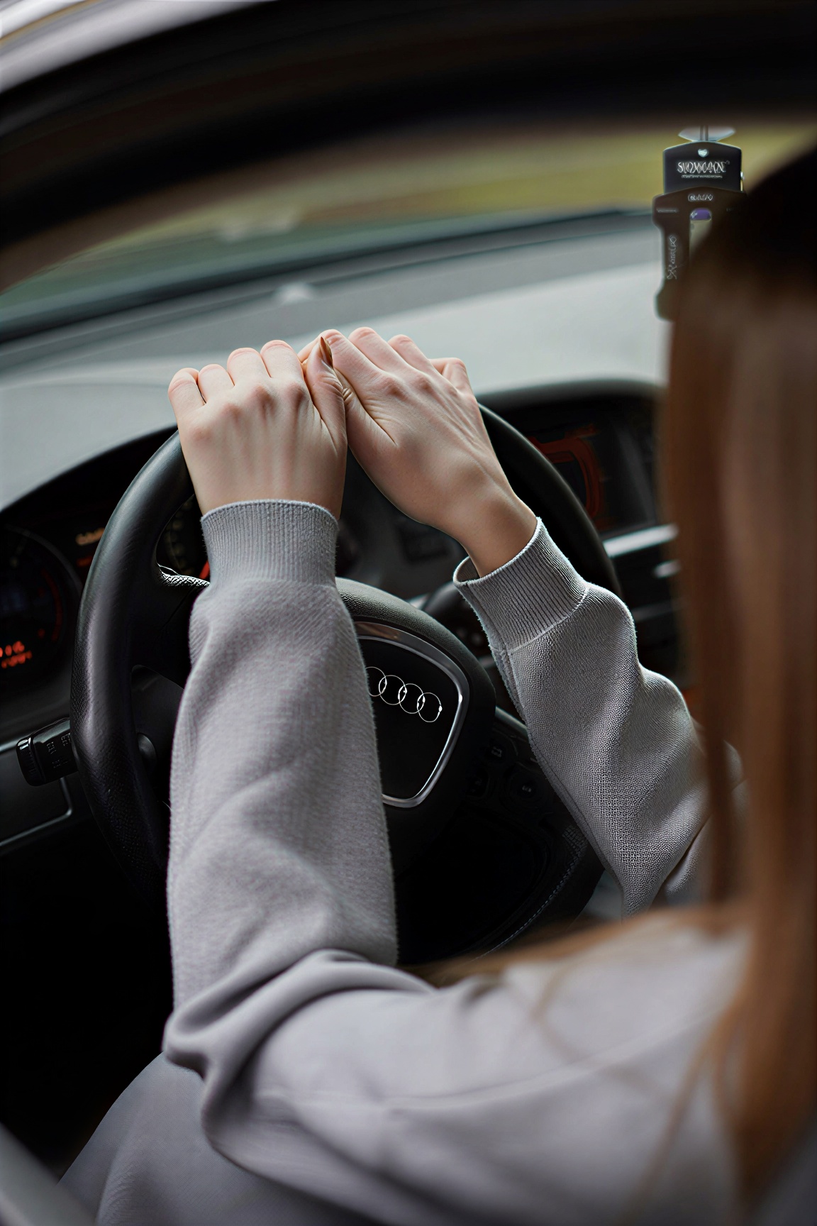 A female passenger traveling safely inside a taxi